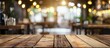 © Lasvu - Empty brown wooden table with blurred Coffee shop background for photo editing or product showcase.