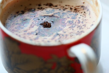 Poster - A simple and cozy cup of coffee on a wooden table, perfect for morning or afternoon pick-me-up.