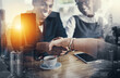 © peopleimages.com - Shaking hands, agreement and business people with city overlay for b2b deal with partnership. Smile, welcome and financial advisors with handshake for client with greeting, thank you or investment.