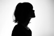 © SKIMP Art - Silhouette of a woman isolated on a white background, the silhouette shown in profile view with no face visible Generative AI
