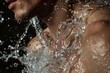 © Elena - Close Up of Mans Face Being Splashed With Water