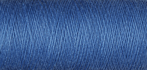 Wall Mural - macro texture of a skein of blue sewing thread