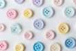 © Ева Поликарпова - A selection of variously colored buttons arranged on a white background