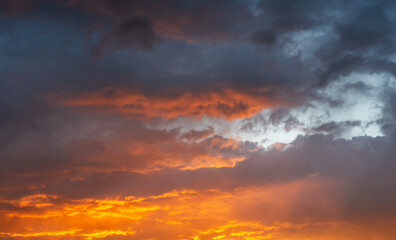 Wall Mural - sky background. bright orange sunset sky with clouds.