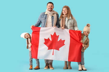 Wall Mural - Happy beautiful family with flag of Canada on blue background