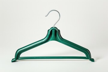 Wall Mural - A single green hanger hanging from a white background