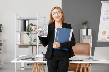 Poster - Female accountant with calculator and folder near workplace in office