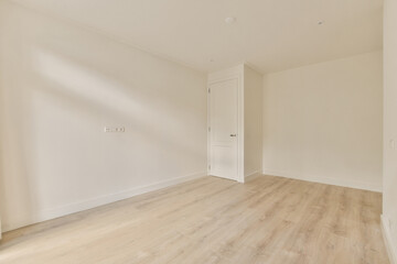 Minimalist empty room with natural light and wooden floor