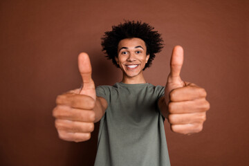 Wall Mural - Photo portrait of young funky guy with funny chevelure hairstyle showing sarcastic like symbols you isolated on brown color background