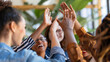© Катерина Євтехова - a close-up image of a diverse group of coworkers high-fiving each other after a successful presentation, Diverse and Inclusive Work, Multiracial Group, Community, Office, Connectio