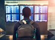 © peopleimages.com - Backpack, travel and man at airport for schedule or reading flight timetable on vacation. Bag, back or person at airline to check departure information on boarding gate with luggage for holiday trip