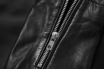 Poster - Texture of black leather jacket with zipper as background, top view