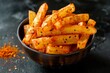 © LimeSky - Kerala snack food spicy tapioca sticks or cassava chips with text space top and side view on black background