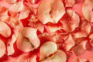 Wall Mural - Pile of homemade apple chips on pink background