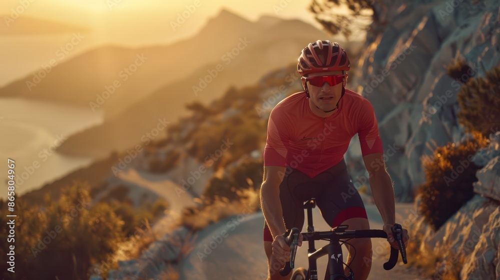 Professional male cyclist road bicycle racer in action riding on a road ...