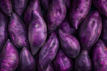 Wall Mural - Purple sweet potato texture background featuring natural color palette of fresh violet vegetables from antioxidant root harvest Ipomoea bata