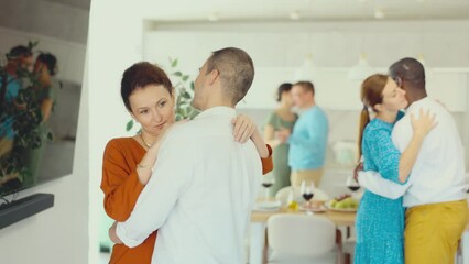 Wall Mural - Couples of men and womMultiethnic male and female couples slow dancing in kitchenen dancing slow dance. High quality 4k footage