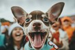 © KanitChurem - Close-up of an excited, happy dog surrounded by cheering fans at an outdoor event, capturing the joyful energy of the moment.