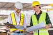 © Poguz.P - Cheerful engineer and foreman worker team inspect the construction site, Site manager and builder on construction site