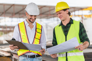 Wall Mural - Cheerful engineer and foreman worker team inspect the construction site, Site manager and builder on construction site