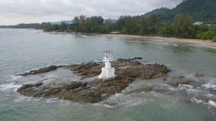 Wall Mural - Aerial top view of lighthouse tower, Khao Lak with seawater, Andaman sea in Phang Nga Bay island in summer season, Thailand. Tourist attraction.