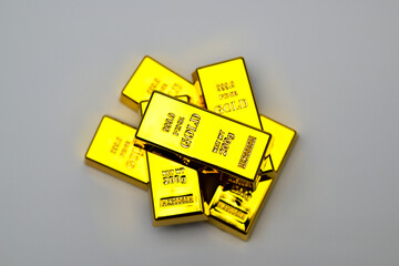 several gold bars on a white background