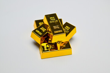 several gold bars on a white background