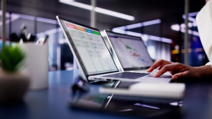 Poster - Focused African American woman using laptop to manage business schedule