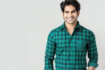 Wall Mural - Confident Young Man in Stylish Green Plaid Shirt Smiling