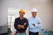 © Drazen - Portrait of happy building contractor and worker at construction site looking at camera.
