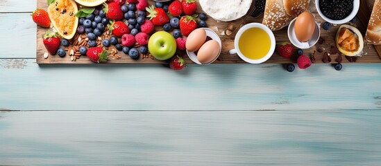 View from above of various breakfast items arranged on a kitchen table background with space for text or graphics regarding cooking, eating, or healthy living. with copy space image
