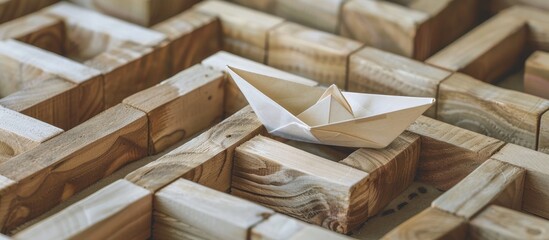 Wall Mural - a paper boat navigating through a wooden block maze represents the business theme of overcoming chal