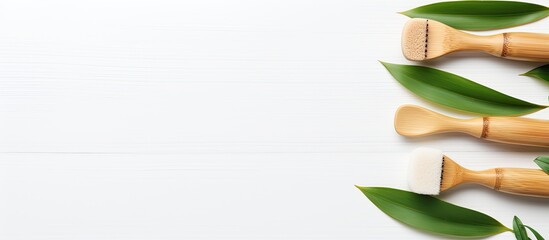 Poster - Top view of eco-friendly bamboo toothbrushes displayed on a white surface with ample copy space for a natural organic bathroom beauty product concept.