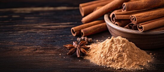 Poster - Close-up shot of Ceylon cinnamon sticks on textured wooden background with cinnamon roll, powder, ideal spice for baking, desserts, and drinks. Includes fragrant ground cinnamon with place for text,