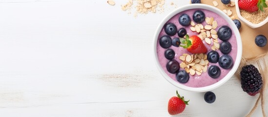 Poster - A healthy dessert with a top view, featuring a smoothie bowl made of mixed berries, banana, and yogurt in a white bowl. Topped with frozen blackcurrant, almonds, and sesame seeds, with space for text