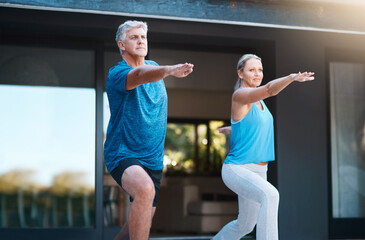 Sticker - Mature, man and woman in home with yoga for wellness, zen mindset with warrior pose for balance. Couple, house and holistic peace with calm movement or breath for fitness, chakra for health or body