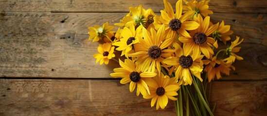 Poster - Vintage yellow flowers arranged in a stunning bouquet on a wooden table with copy space image and isolated.