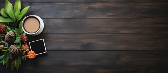 Poster - Flat lay view of a neat setup on a wooden table featuring a small chalkboard, coffee cups, a plant, glasses, and offering space for text in the image. with copy space image