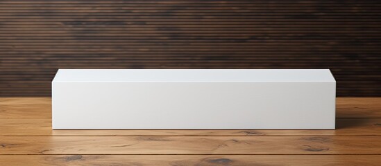 Aufkleber - Mock-up of a long item's packaging in a white cardboard box on a wooden table with a copy space image available.