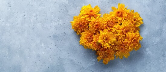Aufkleber - Top view of yellow spring flowers shaped like a heart on a light gray background with copy space image, conveying a creative love concept with delicate chrysanthemum blooms for a springtime floral