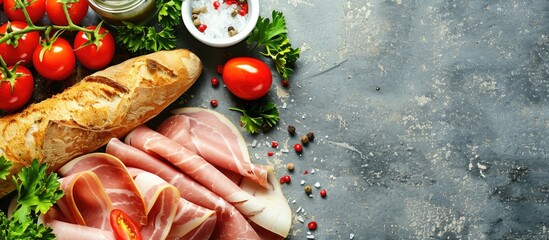 Aufkleber - Selective focus on delicious sliced ham, cherry tomatoes, parsley, salt, and baguette arranged on a wooden grey table with copy space image.