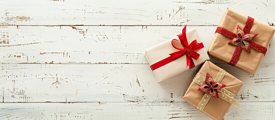 Poster - Two presents displayed on a white wooden surface with copy space image.