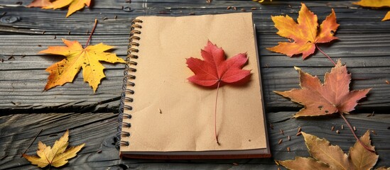 Poster - Notebook with autumn theme displayed in a copy space image.