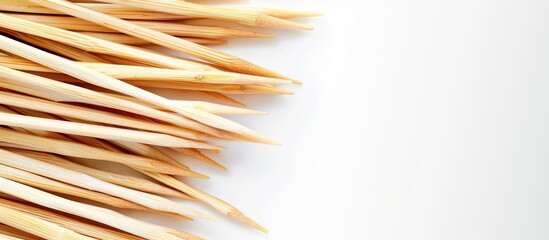Aufkleber - Toothpicks made from bamboo set against a clear white copy space image.
