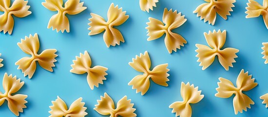 Aufkleber - Top view of uncooked bowtie pasta with room for text or other elements on a blue backdrop, showcasing this Italian culinary staple. Copy space image. Place for adding text and design