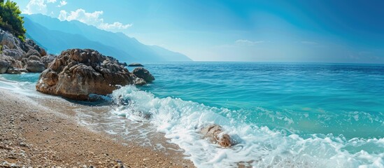 Wall Mural - View of the stunning sea from the shore with copy space image.