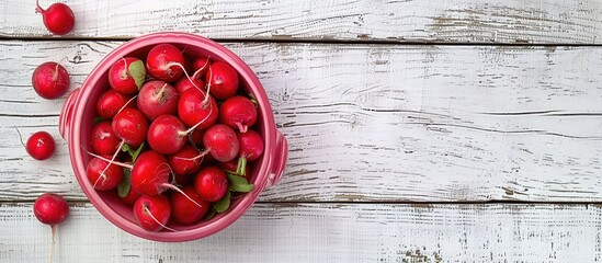 Wall Mural - Top view of red radishes in a pink bowl on a white wooden surface, with copy space image available.