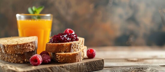 Wall Mural - Whole grain bread with mixed berry jam, accompanied by orange juice in a glass on a wooden backdrop, creating a relaxing scene with copy space image.