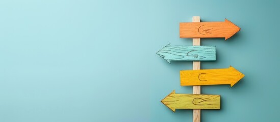 Leinwandbilder - Top view of a paper signpost with arrows on a light blue background, providing copy space image.