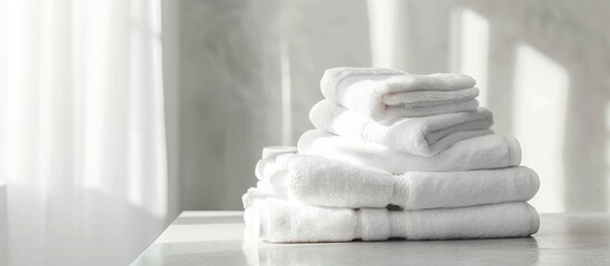 Poster - Copy space image with white terry towels arranged neatly on a bathroom table.